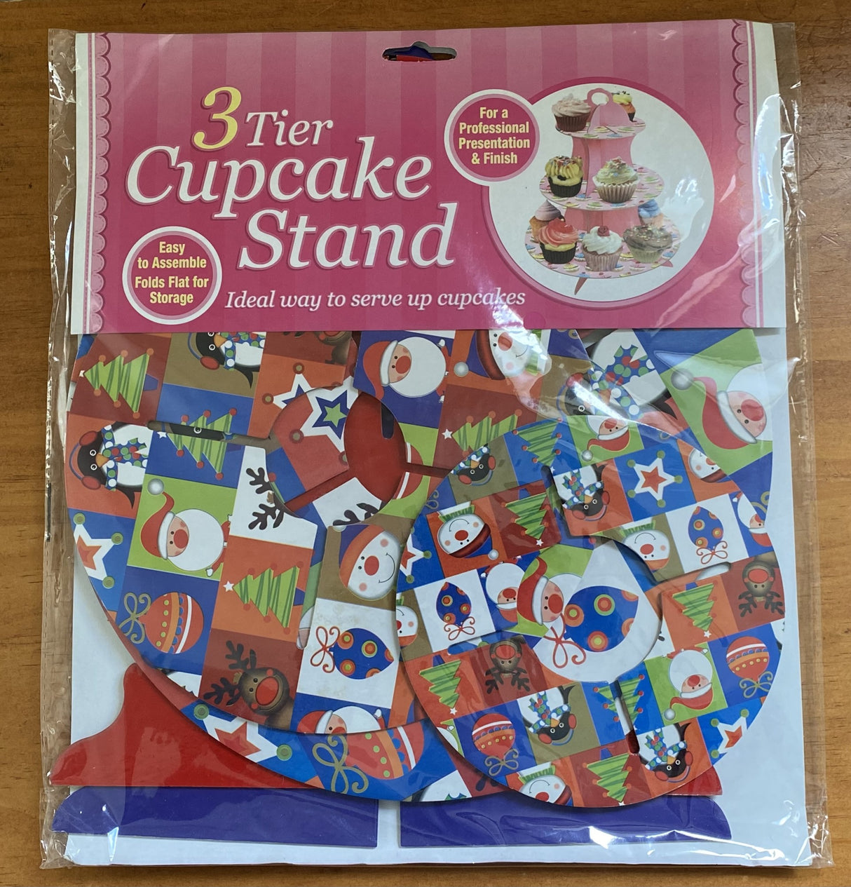 Three-tier cupcake stand set with assorted Christmas designs, perfect for festive dessert displays and holiday gatherings.