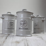 Vintage grey ceramic sugar canister with air-tight seal and embossed 'Finest Sugar' text, perfect for kitchen decor.