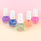 Colorful confetti nail polish adding sparkle and shine, perfect for DIY nail art and festive nail designs.