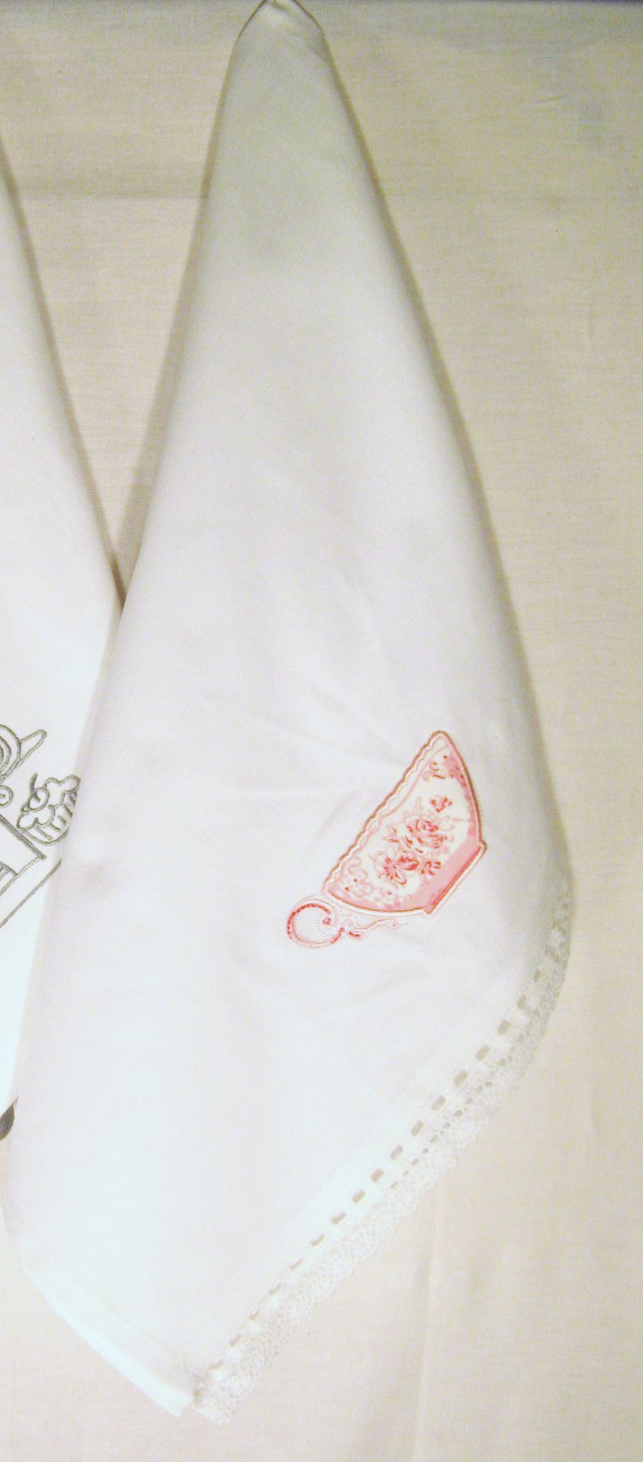 Set of 3 NZ-designed cotton tea towels featuring pastel pink tea cup motif and lace border, perfect for kitchen use.