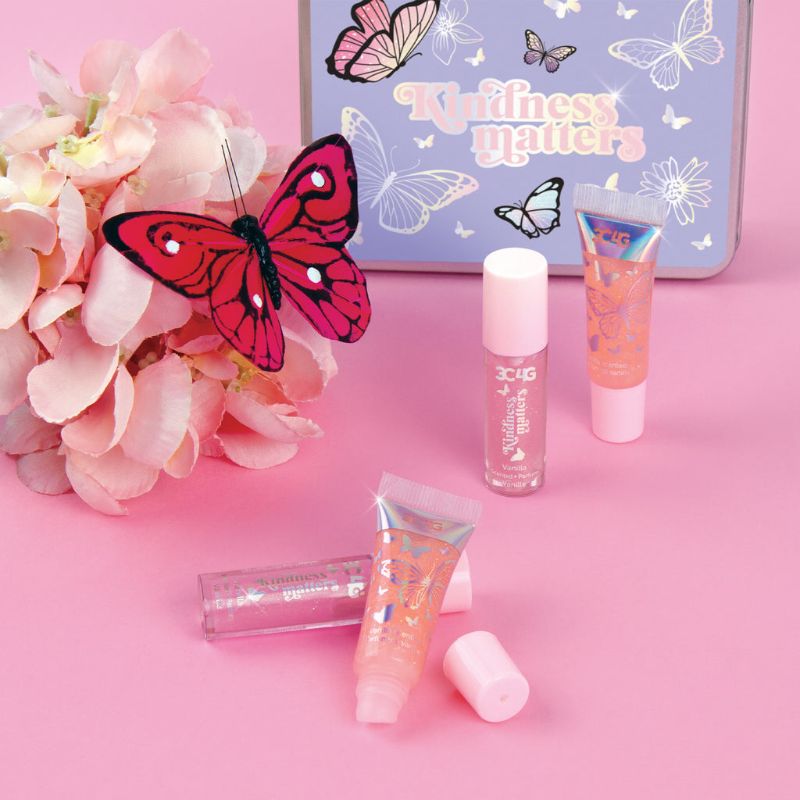 Butterfly Kisses Lip Set: a 4-pack of luxe lip glosses in a whimsical tin, featuring two wand applicators and two tubes.