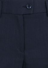 Ladies black bootleg pants with a relaxed fit, mid-rise, horizontal pockets, and breathable fabric for stylish comfort.