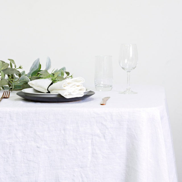 Elegant 100% linen table cloth in white, measuring 150 x 260cm, perfect for enhancing any dining experience.