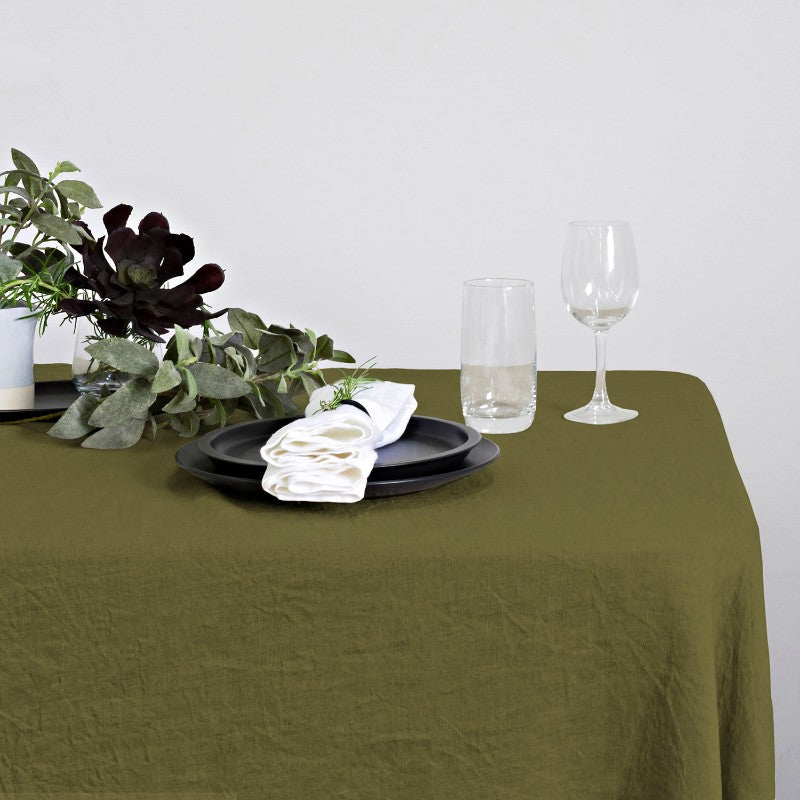 100% linen table runner in olive, measuring 40x150cm, perfect for adding elegance to any dining setting.