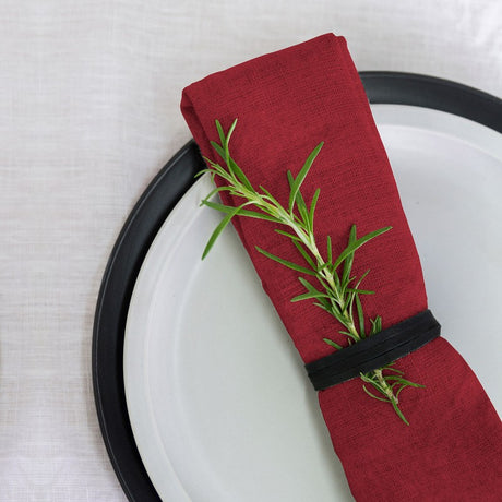 Set of four luxurious red linen napkins, 50 x 50 cm, perfect for elevating any dining occasion.