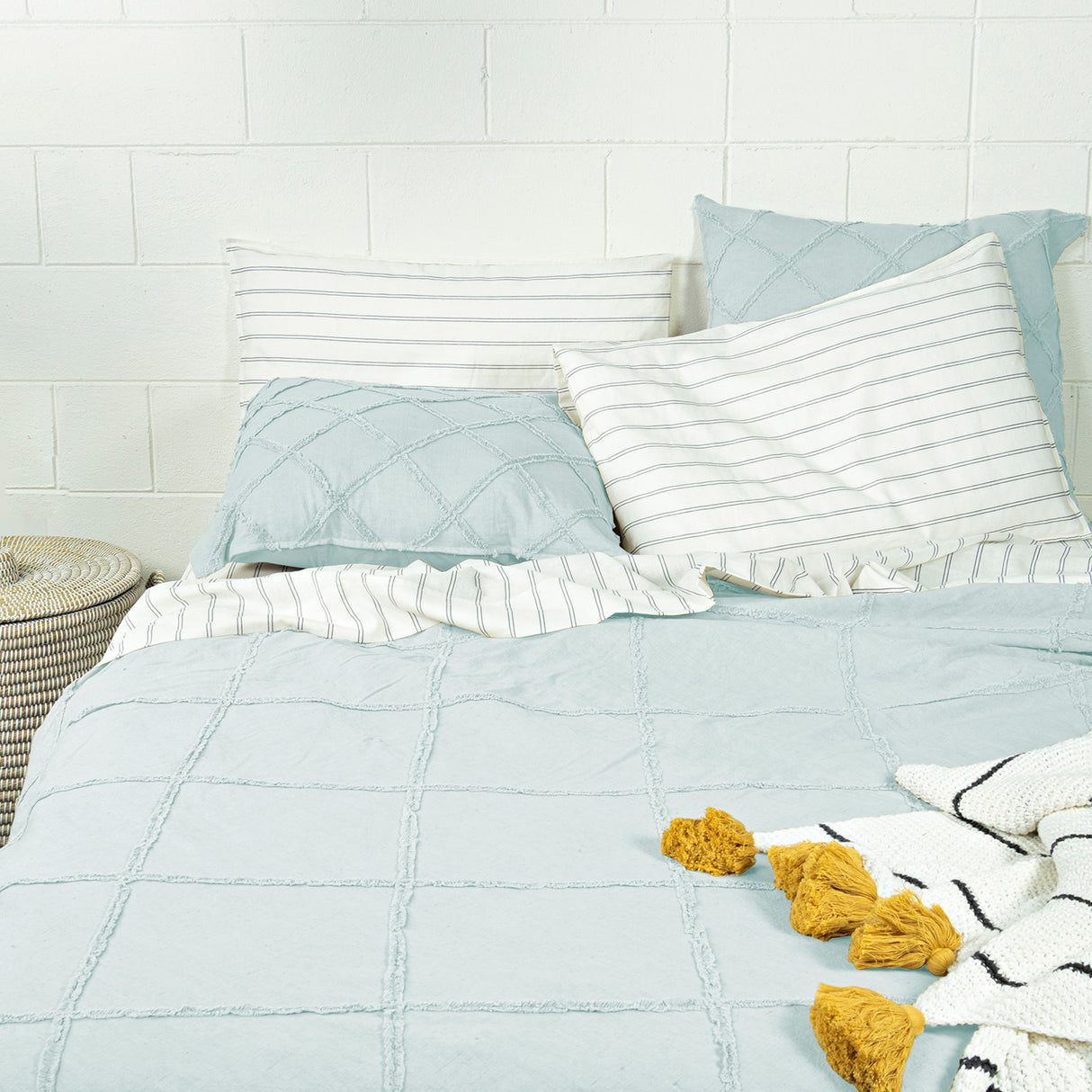 Light blue queen duvet cover set featuring square pattern and lace fringes, includes duvet cover and two pillowcases.