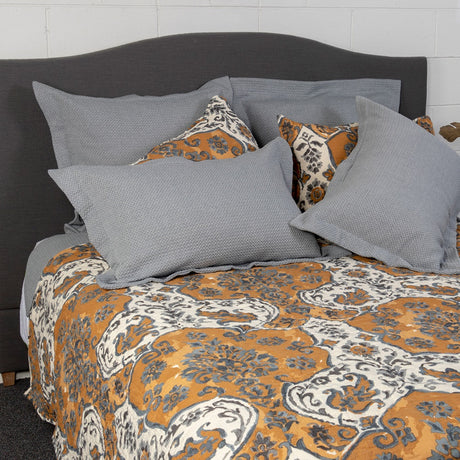 Sophia Queen Quilt featuring intricate Moroccan-inspired designs in muted ochre, grey, charcoal, and ecru, ensuring luxurious comfort.