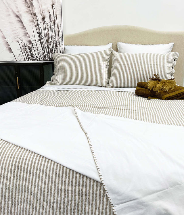 Elegant striped queen duvet cover with button closure, crafted from a linen-cotton blend for comfort and style.