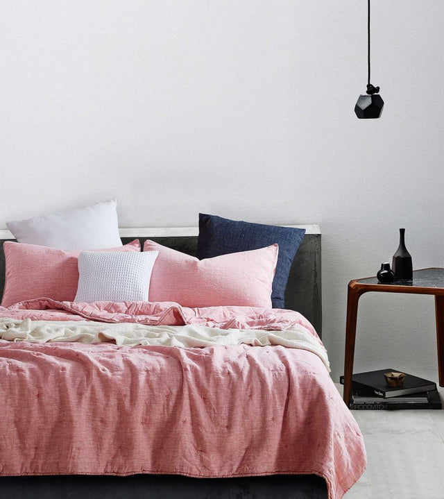 Cot Quilt Set in pink featuring luxe linen front, cotton percale back, and plush polyester filling for comfort and style.