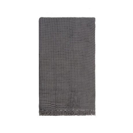 Waffle throw in grey, made from 100% pure cotton, featuring a cozy waffle texture and elegant design for any living space.