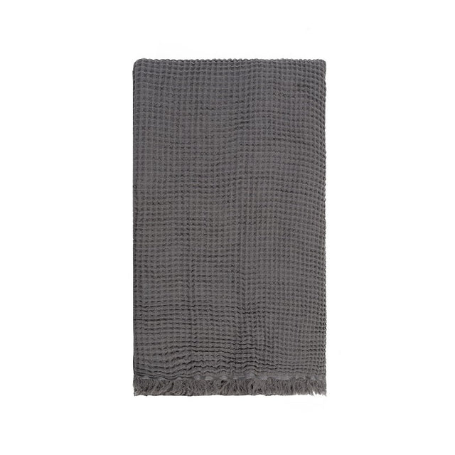 Waffle throw in grey, made from 100% pure cotton, featuring a cozy waffle texture and elegant design for any living space.