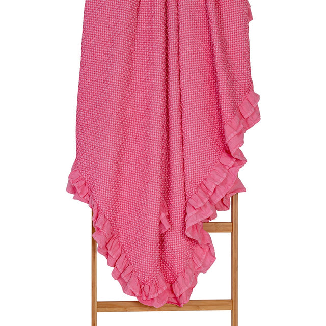 Hot pink cotton waffle blanket with frill, 190x220 cm, offering year-round comfort and vibrant decor appeal.