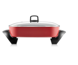 Red electrical frypan with tilt lever, non-stick coating, and tempered glass lid, perfect for cooking large meals.