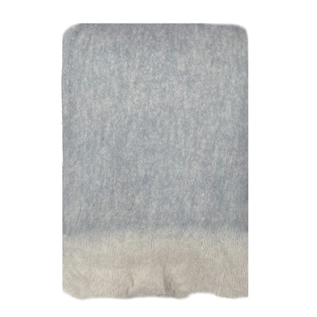 Cozy blue throw blanket with eyelash fringe, crafted from a luxurious wool-mohair blend for warmth and style.