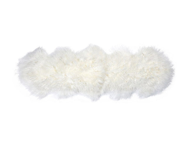 Ivory Tibetan Lamb Fur Double Rug (60x160cm) adds luxury and warmth to any space with its soft, hypoallergenic surface.