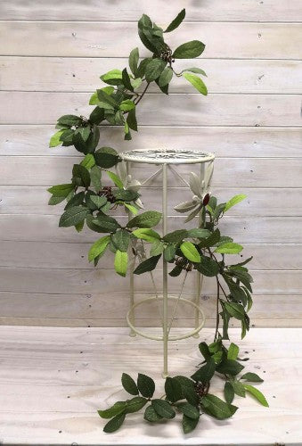 Lifelike 1.8m laurel leaf garland with berries in fall green, perfect for seasonal decor and versatile arrangements.