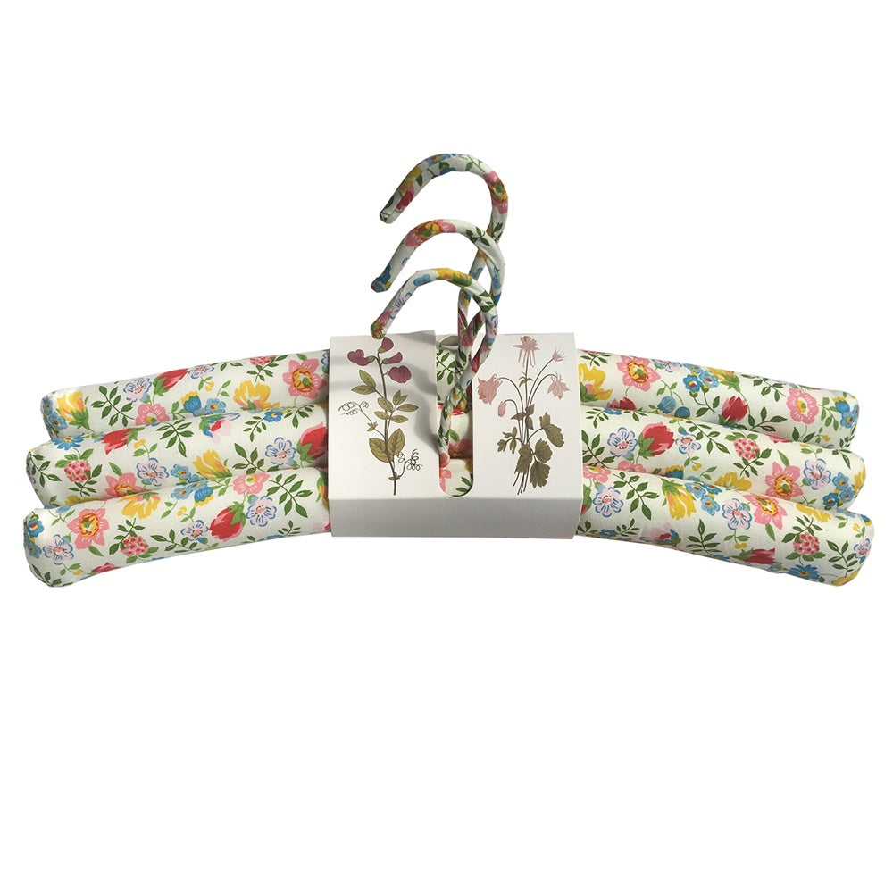 Handcrafted set of 3 coat hangers featuring unique wildflower designs for elegant wardrobe organization.