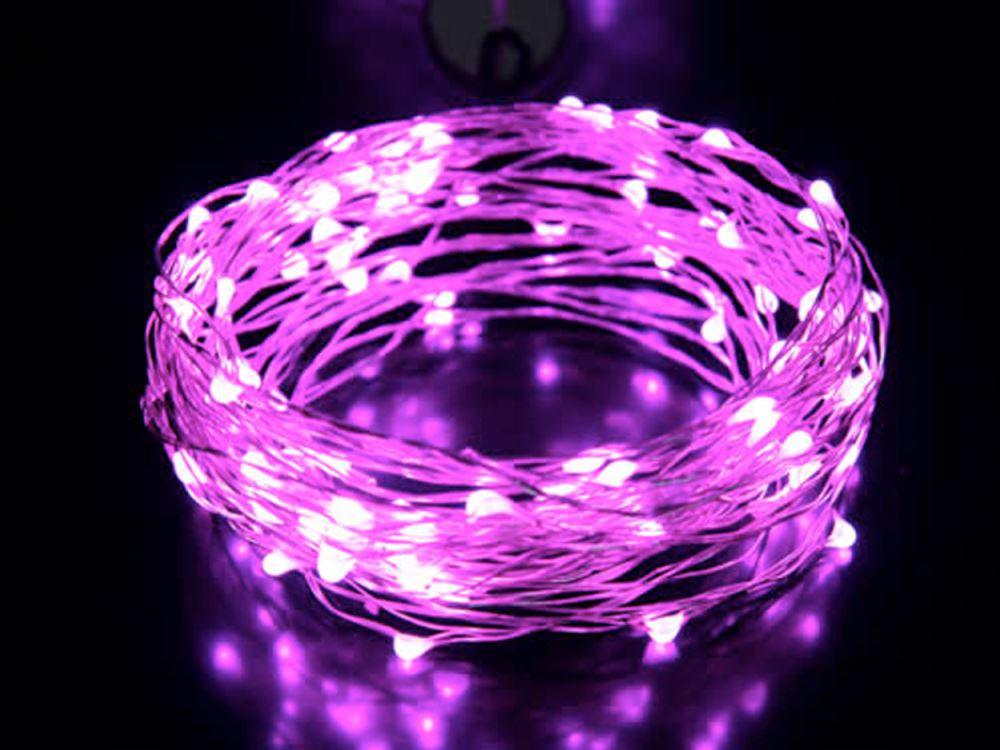 Delicate 10M silver wire fairy lights with 100 warm pink LEDs, perfect for creating a magical indoor atmosphere.