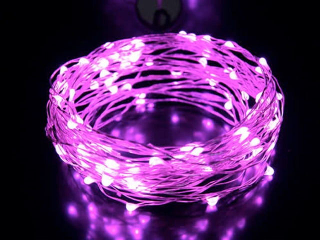 Delicate 10M silver wire fairy lights with 100 warm pink LEDs, perfect for creating a magical indoor atmosphere.