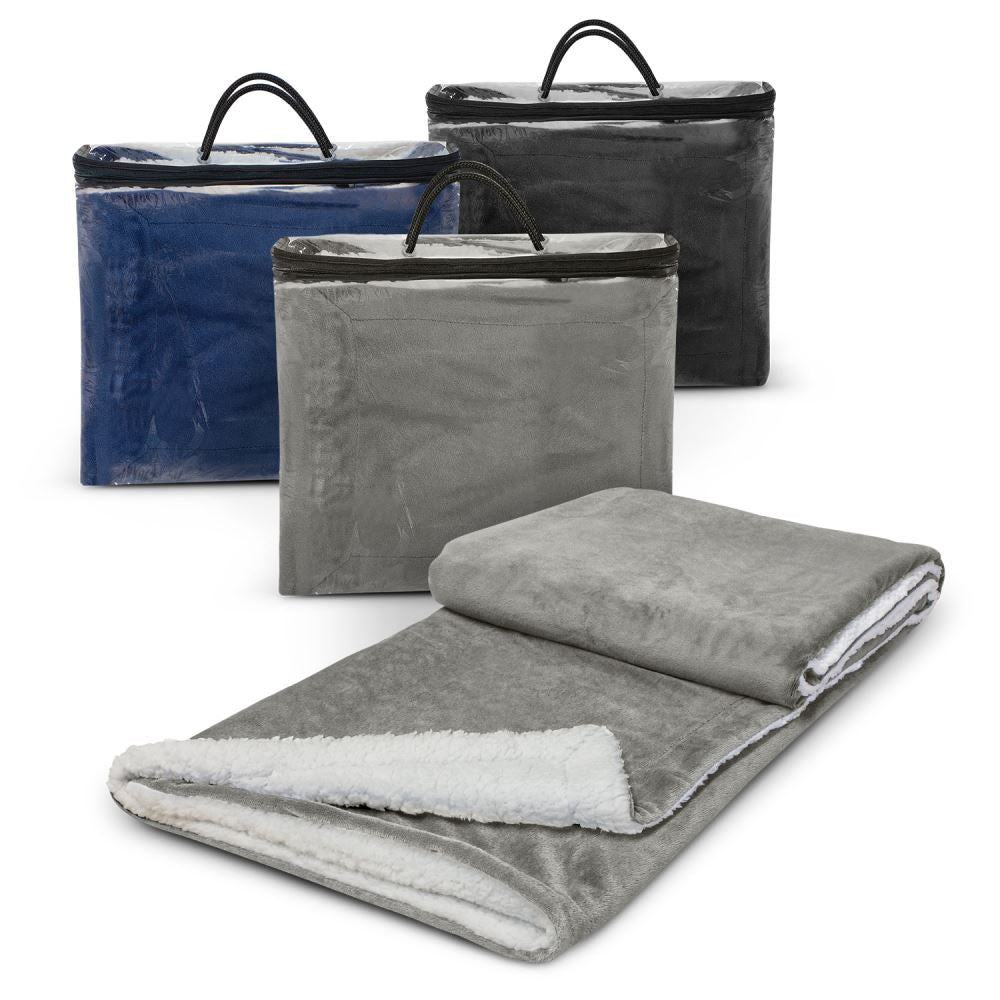 Elegant grey Oslo Luxury Blanket, crafted from soft Shu Velveteen fleece, ideal for home or outdoor use, packaged in a zippered bag.