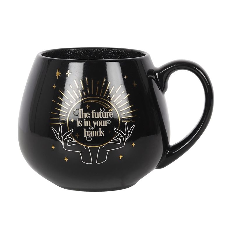 Black ceramic mug that reveals a fortune in a crystal ball when filled with hot liquid, holding 500ml of beverage.