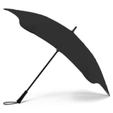 Sleek black BLUNT Exec umbrella for two, designed for durability and elegance in urban rainstorms.