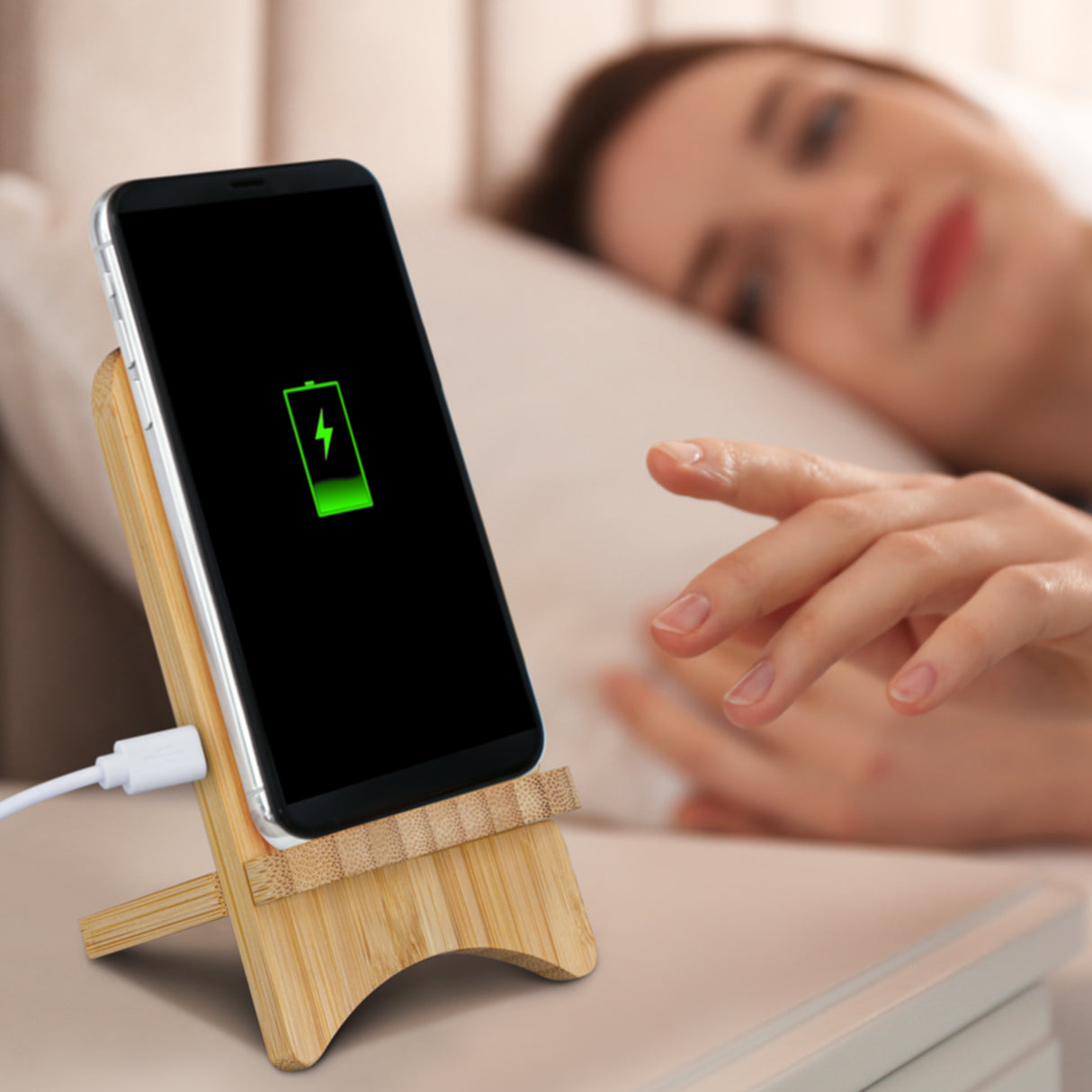 Eco-friendly bamboo wireless charging stand for modern smartphones, stylish and easy to assemble with an 80cm USB cable.