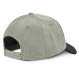 Light grey and black structured cap featuring a leather-look hexagonal patch, sweatband, and adjustable Velcro closure.