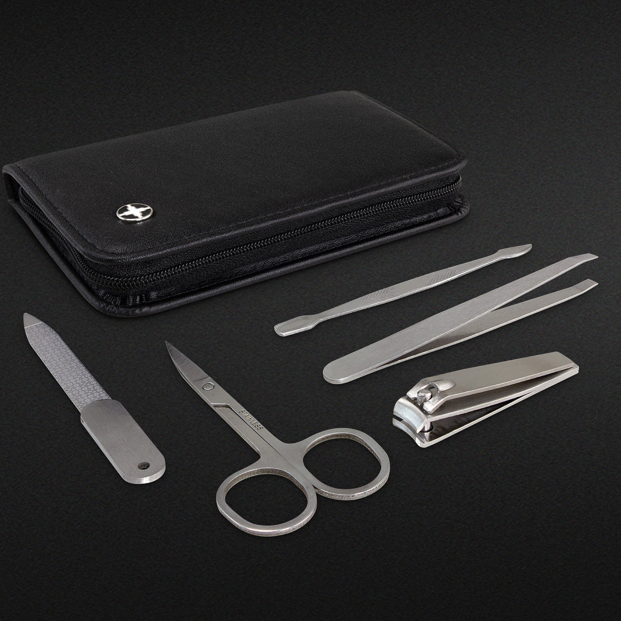 Black Swiss Peak Manicure Set featuring five stainless steel tools in an elegant case, perfect for travel and home grooming.