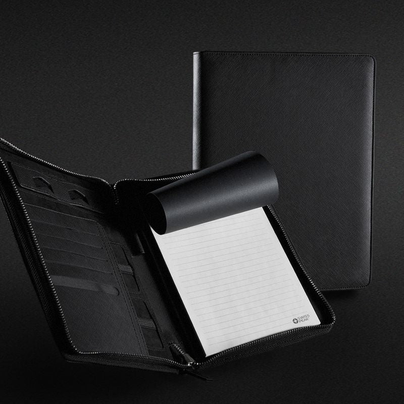 Sleek black A4 portfolio with zipper, premium Italian PU leather, notepad, phone stand, and sophisticated Swiss Peak badge.