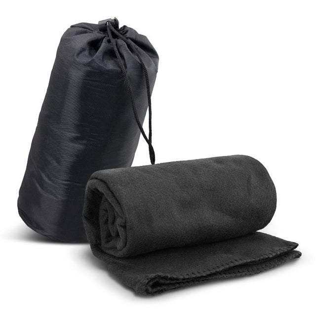 Soft black fleece blanket in a durable carry bag, perfect for home comfort and outdoor adventures, measuring 1200mm x 1500mm.