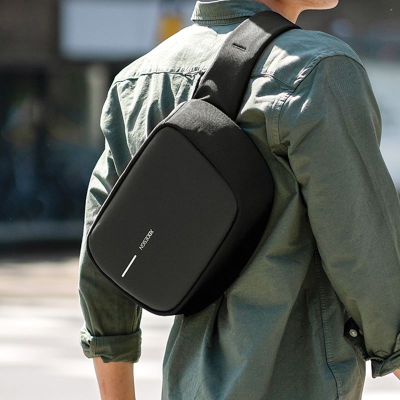 Bobby Sling Bag in black, featuring anti-theft design, USB charging, and eco-friendly materials for stylish urban travel.