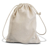 Bamboo travel set with hairbrush, nail brush, and exfoliator, packaged in a cotton gift bag for eco-conscious travelers.