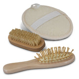 Eco-friendly Inti Travel Set with bamboo hairbrush, nail brush, and exfoliator in a cotton gift bag, ideal for sustainable travel.