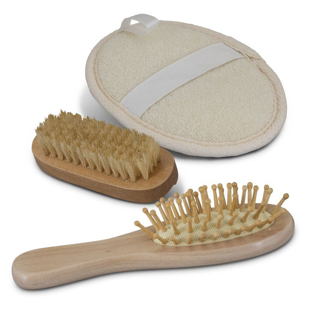 Eco-friendly Inti Travel Set with bamboo hairbrush, nail brush, and exfoliator in a cotton gift bag, ideal for sustainable travel.