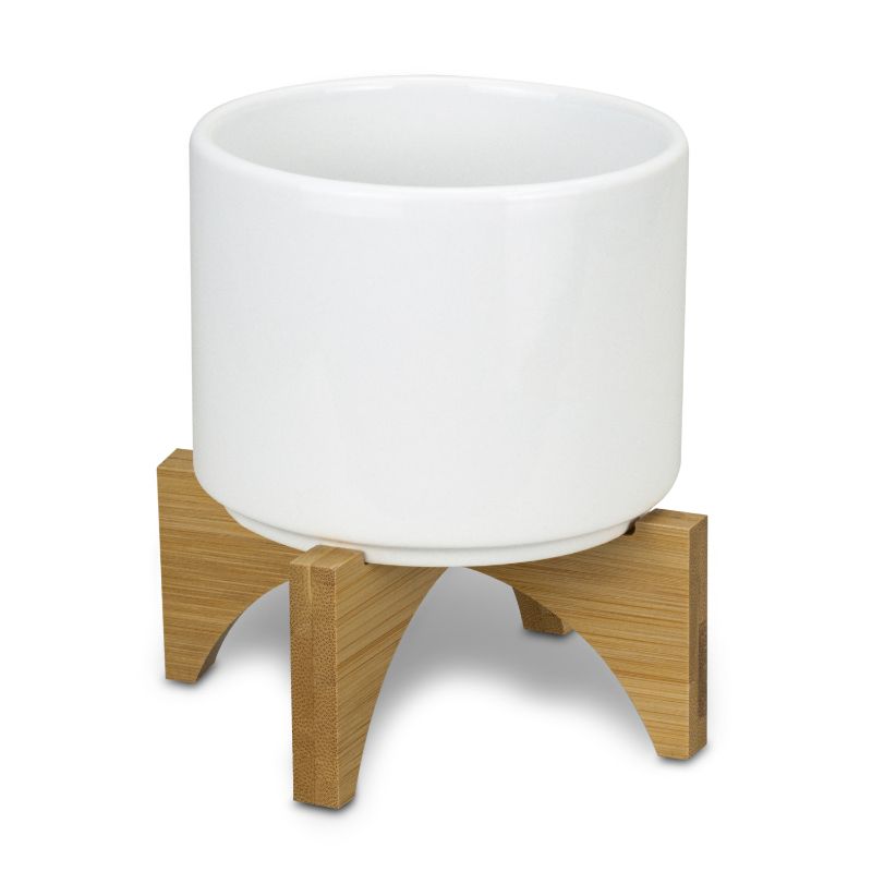 Set of 6 modern ceramic planters with bamboo bases, ideal for indoor plants, enhancing decor with eco-friendly style.