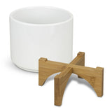 Set of 6 modern ceramic planters with bamboo bases, designed for indoor plants in white and natural tones.