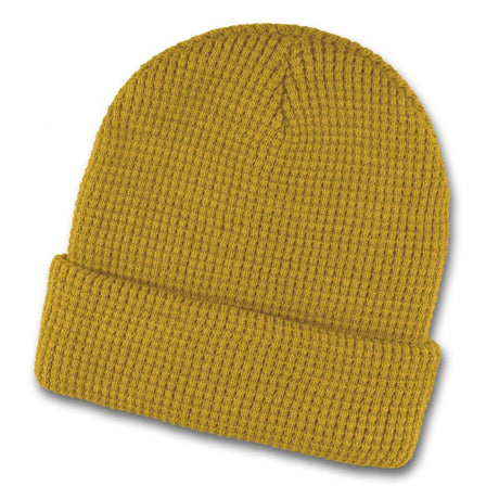 Mustard yellow acrylic beanie with a trendy waffle knit pattern and roll-up cuff, perfect for winter wear.