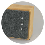 Natural finish Bluetooth Speaker made from bamboo, offering 10W sound, 6-hour playtime, and stylish design with heather front.
