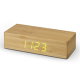 Natural bamboo wireless charging clock with LED display for time, date, temperature, and integrated 5W charger.