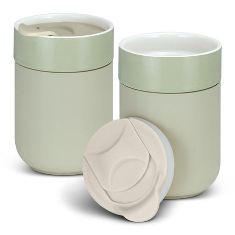 Set of 3 stylish ecru ceramic coffee cups with heat-resistant silicone sleeves, ideal for hot beverages on the go.