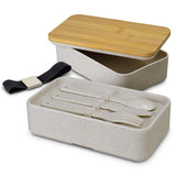 Eco-friendly stackable lunch box made from wheat straw and BPA-free plastic, includes utensils and bamboo lid.