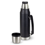 Stainless steel Wayfarer Black Flask with double-wall vacuum, screw-on cup, and carry handle, perfect for outdoor adventures.