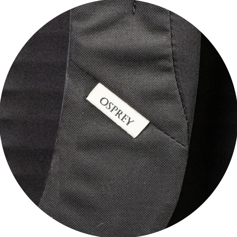 Osprey Arcane Large Day Backpack in black with padded laptop sleeve, J-zip front, and self-locking hook for secure daily use.