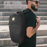Osprey Arcane Large Day Backpack in black, featuring padded laptop sleeve, spacious compartments, and eco-friendly materials.