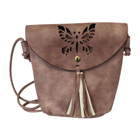 Dusky rose shoulder bag with cut-out butterfly, tassel detail, zip opening, and adjustable strap for stylish versatility.