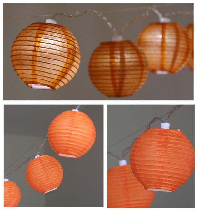 Vibrant orange mini paper lanterns with LED lights, perfect for decorating events, featuring 24 units on a 2.5m strand.