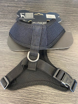 Soft mesh black dog harness for medium breeds, featuring breathable fabric, secure buckle, and adjustable straps for comfort.