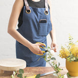 Stylish dark blue denim apron with pockets, adjustable neck strap, ideal for cooking and crafting, measuring 81x87cm.