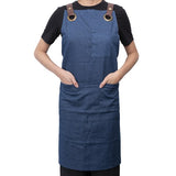 Stylish dark blue denim apron with pockets, adjustable neck strap, and 81x87cm size for cooking or crafting.
